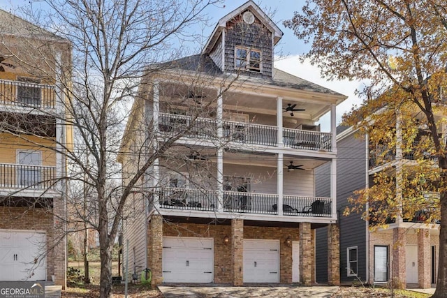 view of front of house featuring a garage and a balcony