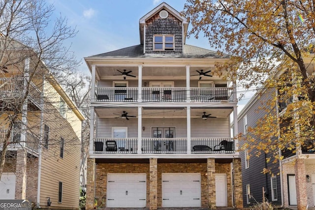 view of front of home featuring a garage and a balcony