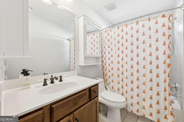 bathroom featuring walk in shower, tile patterned flooring, vanity, and toilet