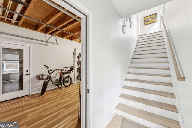 staircase featuring hardwood / wood-style flooring