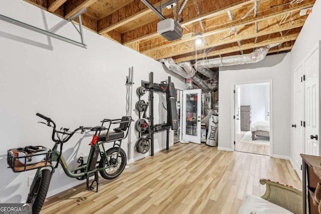 workout room with hardwood / wood-style flooring