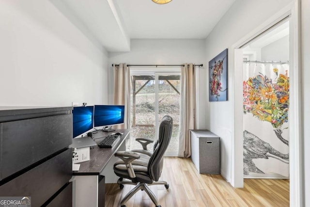 office space with light hardwood / wood-style floors