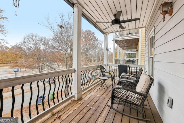 wooden deck with ceiling fan