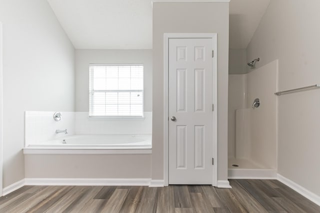 bathroom featuring separate shower and tub and hardwood / wood-style flooring