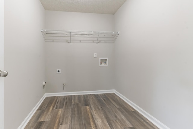 clothes washing area featuring hookup for an electric dryer, dark hardwood / wood-style flooring, a textured ceiling, and washer hookup