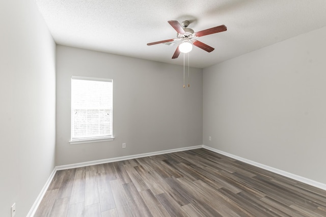 unfurnished room with a textured ceiling, dark hardwood / wood-style floors, and ceiling fan