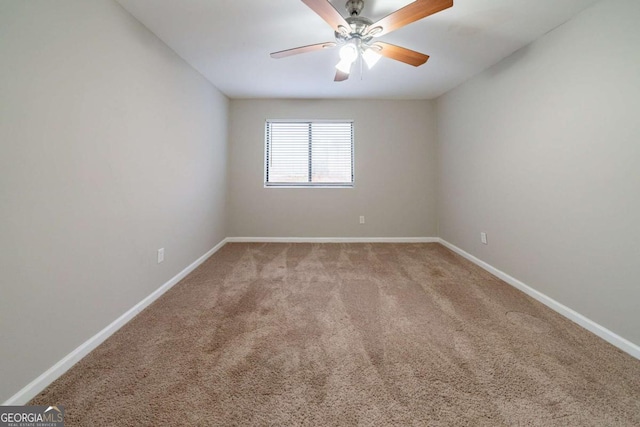 unfurnished room featuring light carpet and ceiling fan