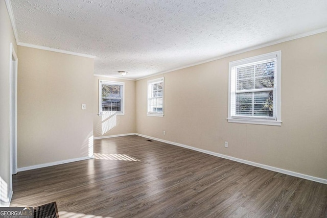 unfurnished room with dark wood-type flooring, a textured ceiling, and ornamental molding