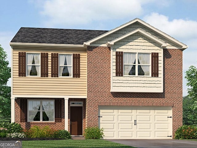 view of front of house with a garage and a front lawn