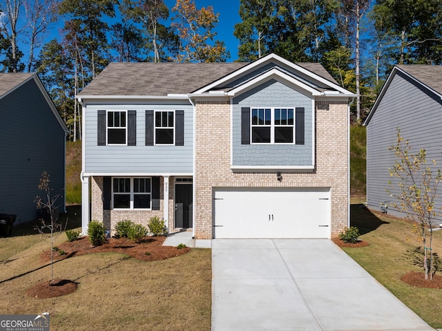 view of front of home featuring a front yard and a garage