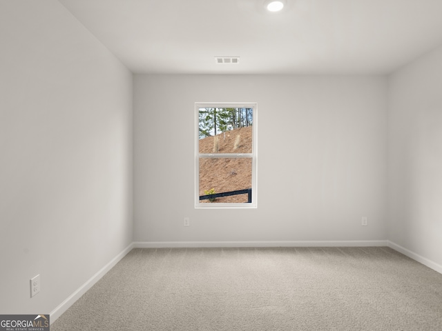 unfurnished room featuring carpet flooring