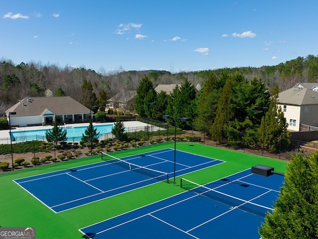 view of sport court featuring basketball hoop