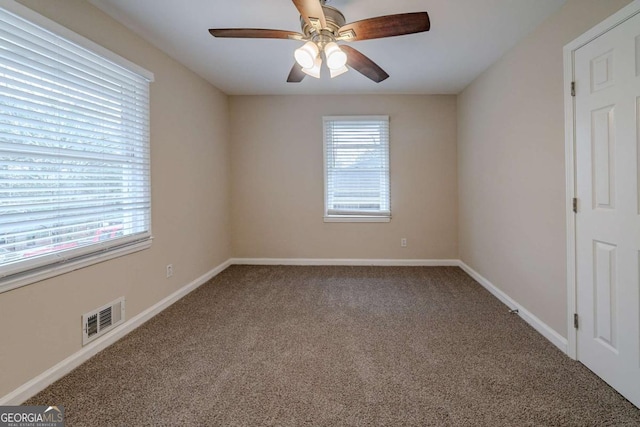 unfurnished room with carpet floors and ceiling fan