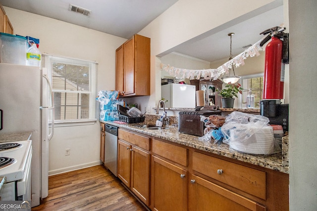 kitchen with sink, dishwasher, light stone counters, white electric stove, and hardwood / wood-style floors