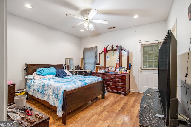 bedroom featuring ceiling fan and light hardwood / wood-style flooring