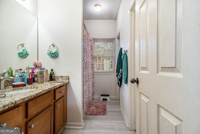 bathroom featuring hardwood / wood-style floors and vanity