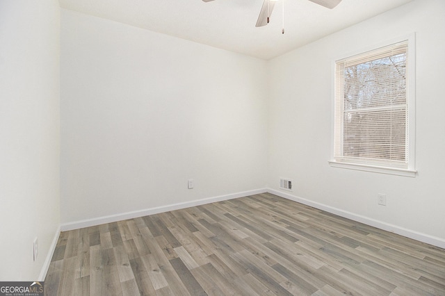 unfurnished room featuring hardwood / wood-style flooring