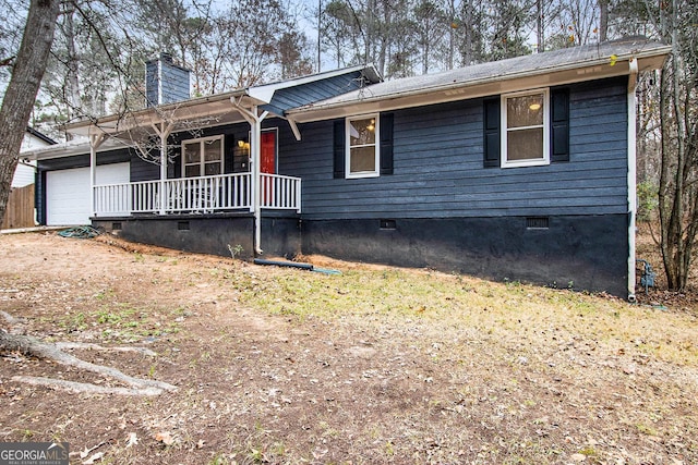 ranch-style house featuring a porch and a garage