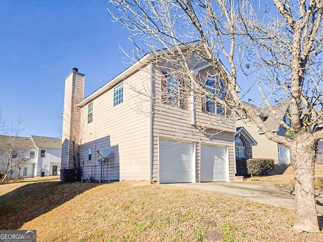 view of side of home with a garage