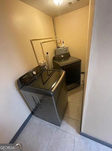 clothes washing area featuring washing machine and clothes dryer