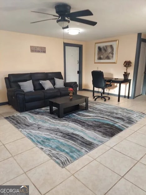 living room with tile patterned flooring and ceiling fan