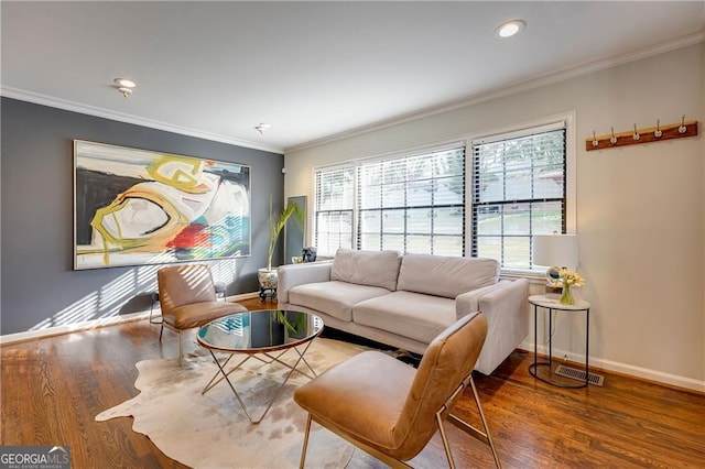 living room featuring crown molding and hardwood / wood-style flooring