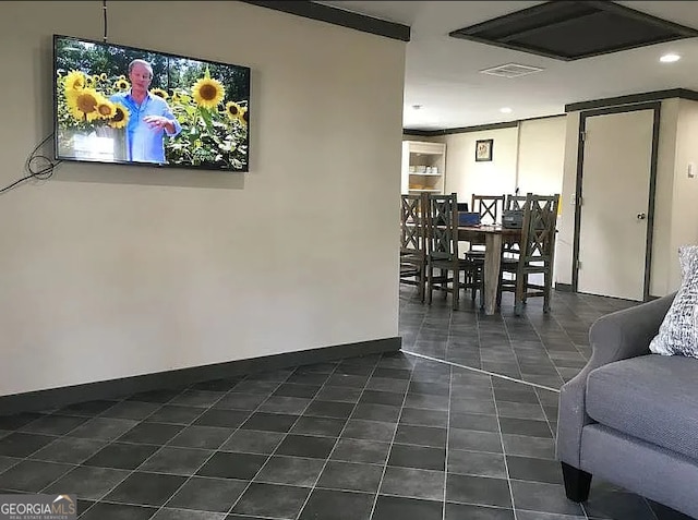 interior space with dark tile patterned flooring