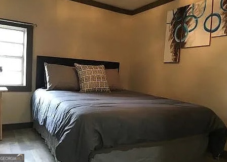 bedroom featuring ornamental molding