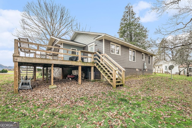 back of house with a wooden deck