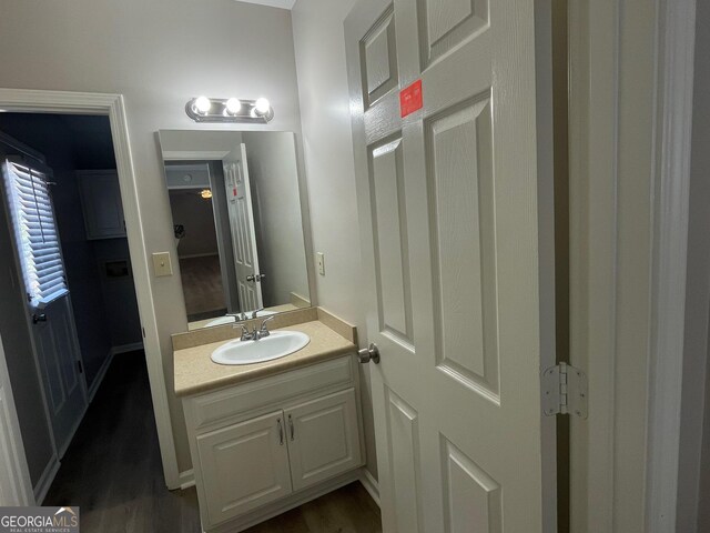 bathroom featuring vanity and hardwood / wood-style flooring