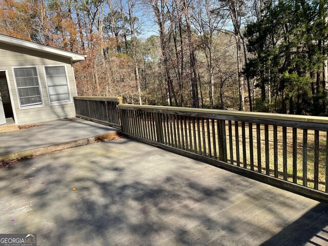 wooden terrace featuring cooling unit