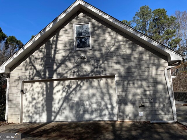 view of side of home with a garage