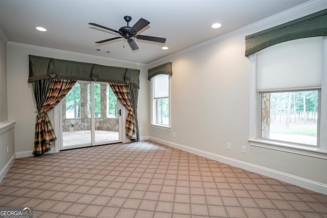 empty room with ceiling fan, a healthy amount of sunlight, and crown molding