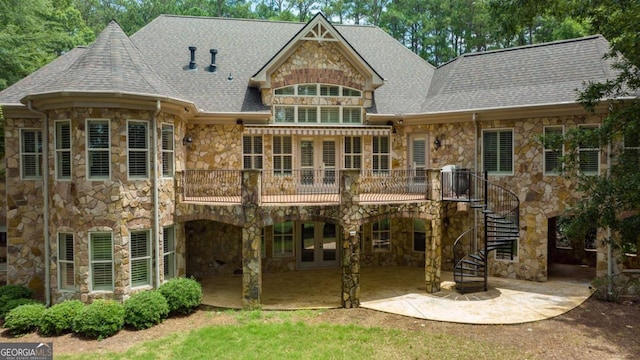 back of house with a patio