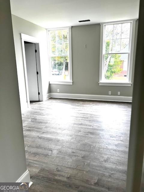 unfurnished room featuring hardwood / wood-style flooring