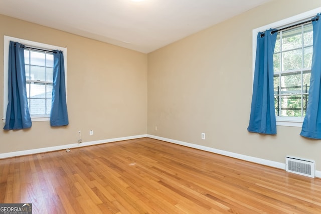 spare room featuring light wood-type flooring