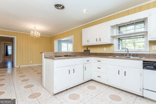 kitchen with white appliances, white cabinetry, ornamental molding, and sink