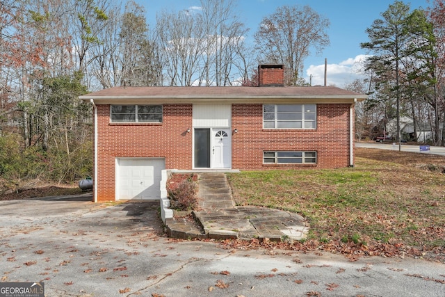 raised ranch featuring a garage