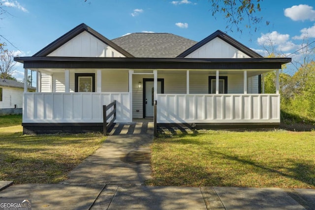 bungalow-style home featuring a front lawn and a porch