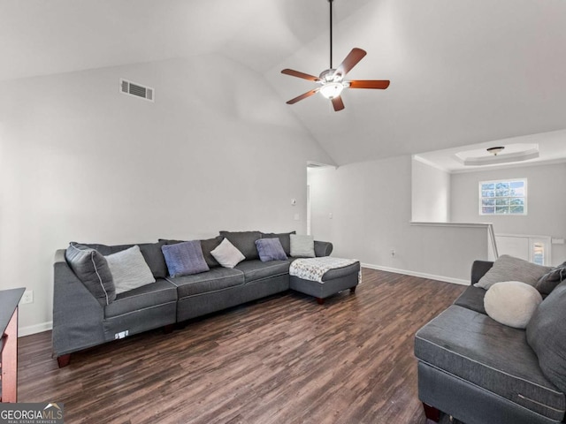 living room featuring vaulted ceiling, ceiling fan, and dark hardwood / wood-style floors