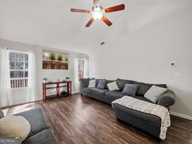 living room with dark hardwood / wood-style floors, vaulted ceiling, and ceiling fan