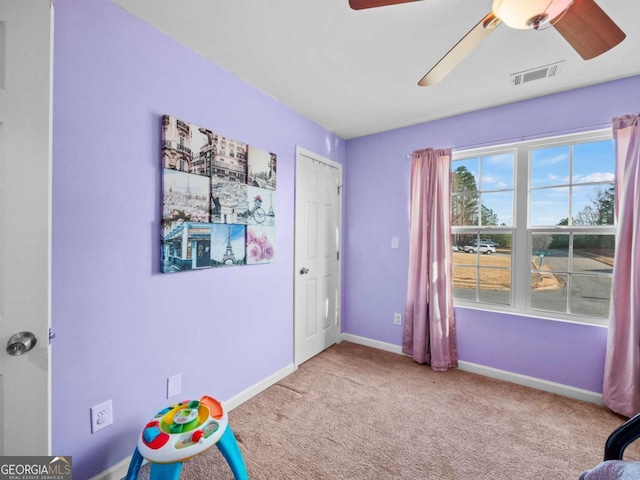 rec room featuring light colored carpet and ceiling fan