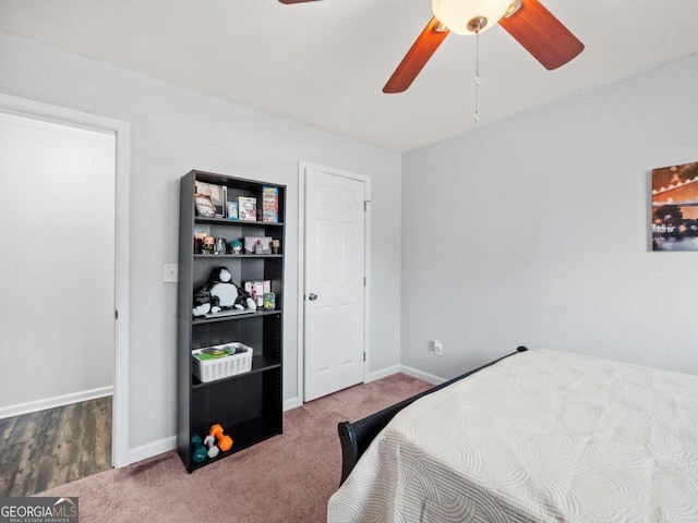 bedroom featuring hardwood / wood-style floors and ceiling fan