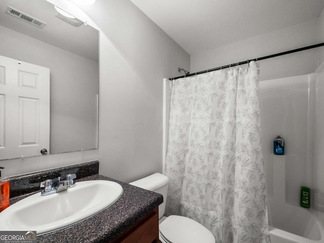 full bathroom featuring vanity, toilet, and shower / bath combo