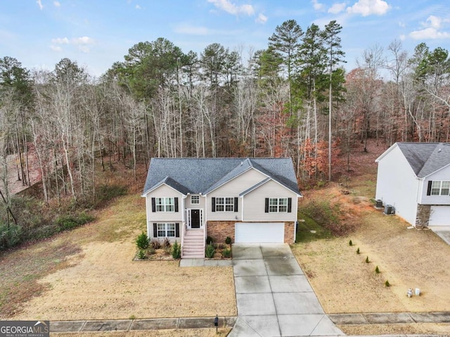 view of front of home featuring a garage and a front lawn