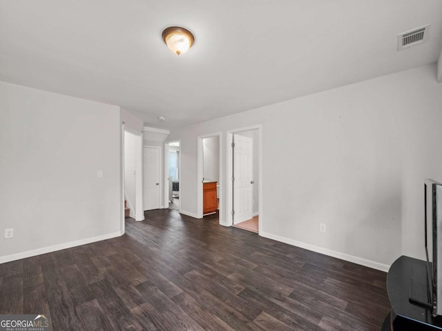 unfurnished living room featuring dark hardwood / wood-style floors