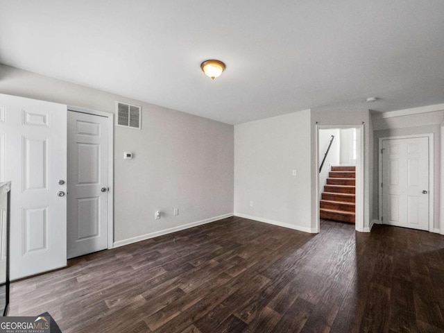 interior space with dark hardwood / wood-style flooring