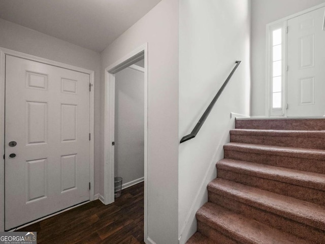 entryway with dark hardwood / wood-style floors