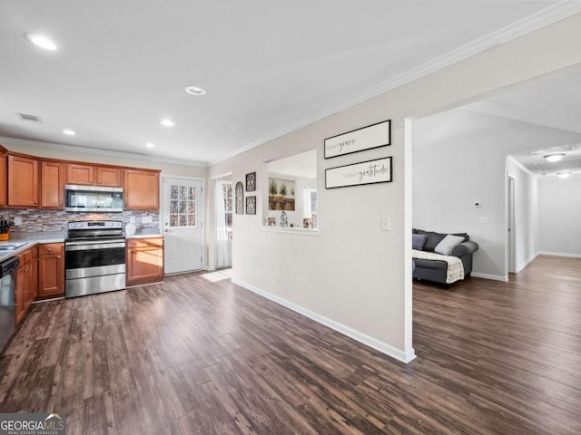 kitchen with tasteful backsplash, ornamental molding, stainless steel appliances, and dark wood-type flooring