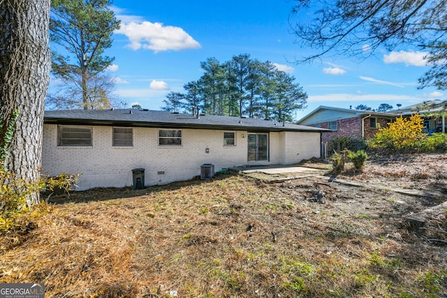 back of property featuring central air condition unit and a patio